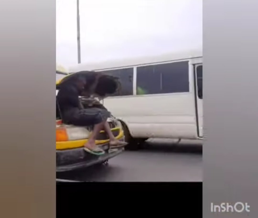 Bus Conductor Holds Bonnet Of Moving Bus Bus Conductor Holds Bonnet Of Moving Bus